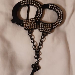 Black metal handcuff belt buckle with bling